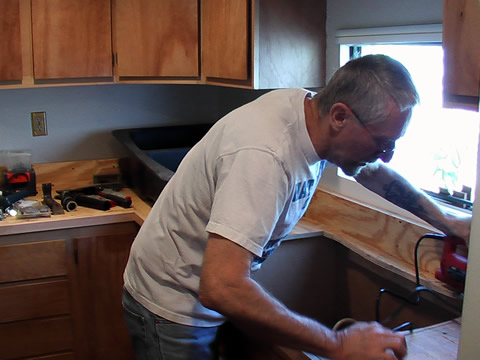 touching the kitchen